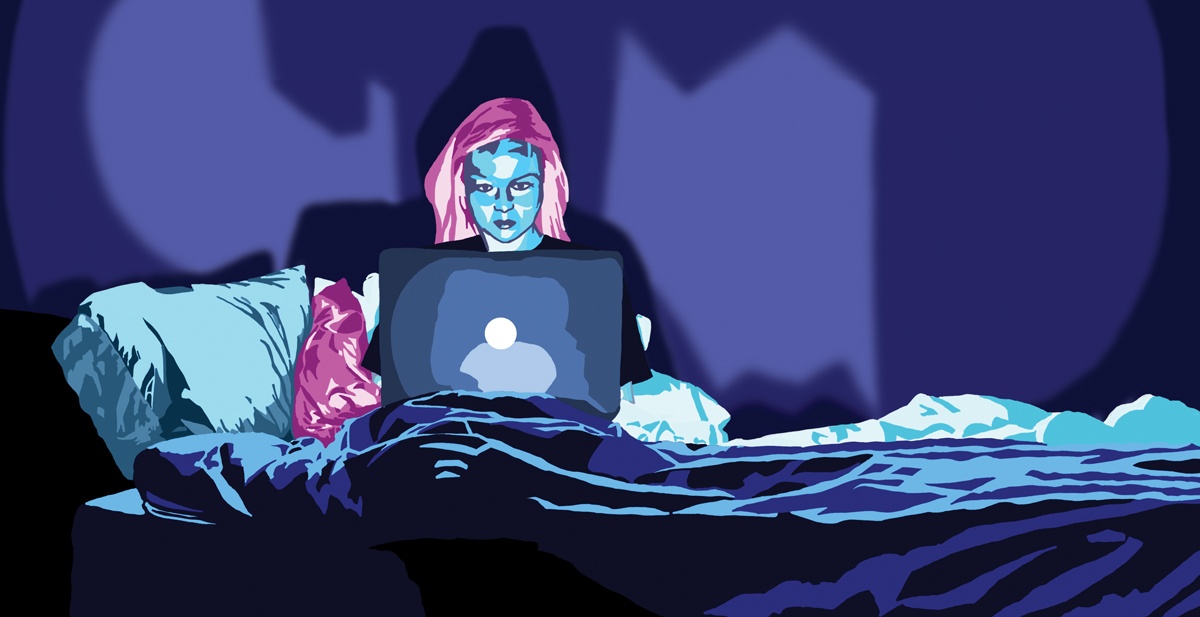 A lawyer studies on her laptop late at night